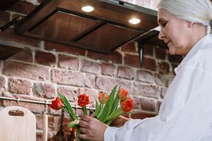 Woman arranging flowers